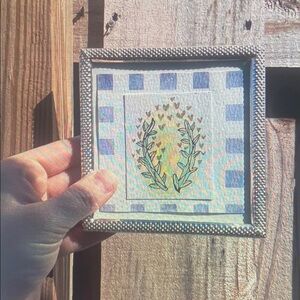 Decorative Framed Art with Blue and Yellow Design